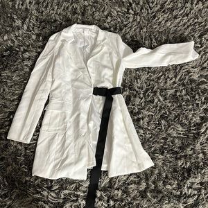 Blazer with seatbelt buckle